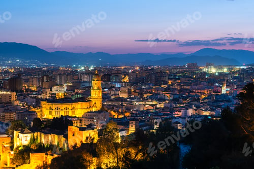 Preview: Malaga skyline, Spain cityscape with Cathedral, City Hall and Alcazaba citadel of Malaga at dusk