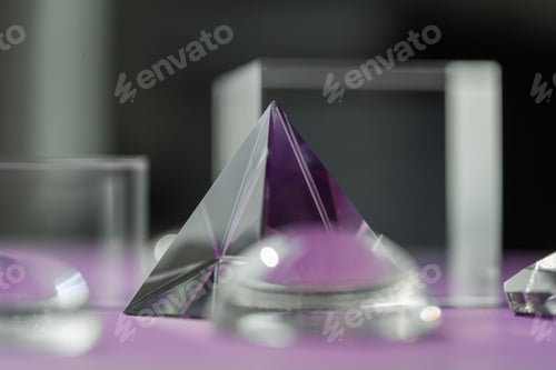 Preview: Crystal prism refracting light, magic crystals and pyramid, sphere and cube on purple background