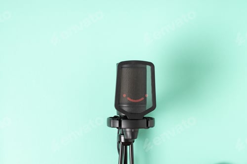 Preview: Microphone on a light blue background with a space for text.