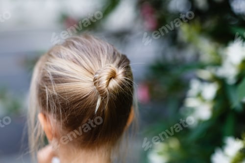 Preview: Close-Up of a Child's Blonde Hair Bun