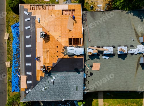Preview: Construction worker on renovation roof the house installed new shingles