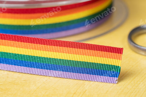 Preview: Rainbow ribbon of LGBT on yellow background