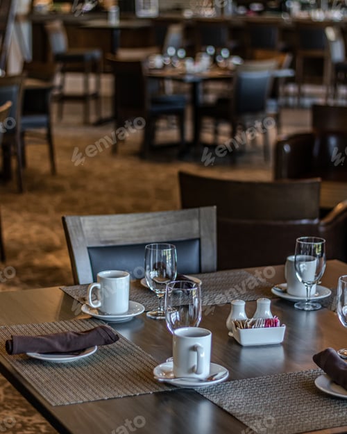 Preview: Vertical shot of neat tables in a nice, empty and clean restaurant
