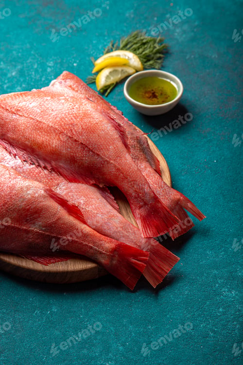 Preview: Fresh red sea bass on blue background.