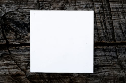 Preview: f overhead top view of white square frame on top of dark wooden scratched surface mock up concept, c