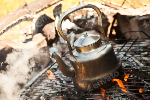Preview: Kettle with water heated on the fire