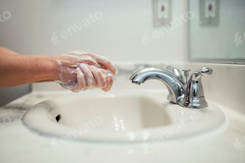 Preview: Woman washing her hands with soap during coronavirus pandemic