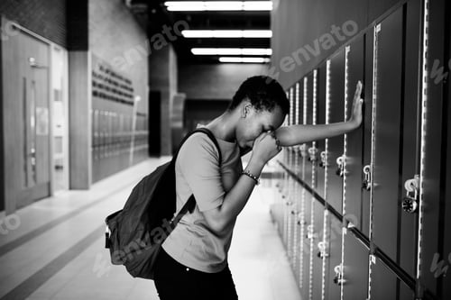 Preview: Young sad student on the hallway