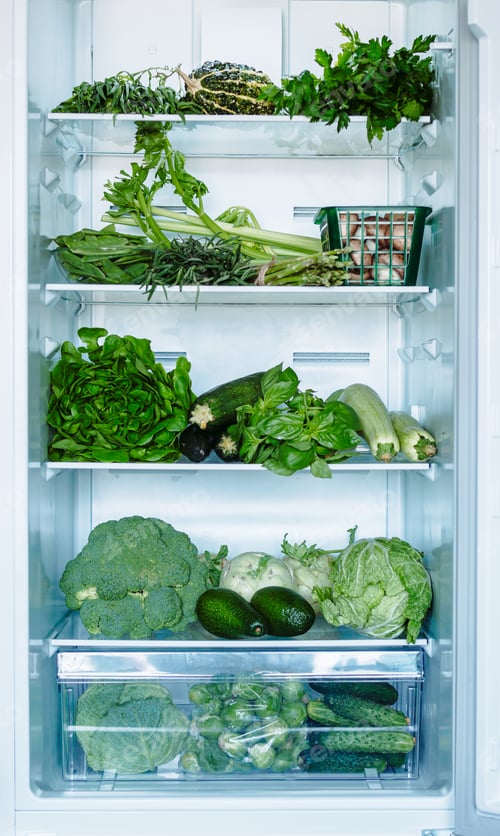 Preview: Green vegetables and greens in open refrigerator