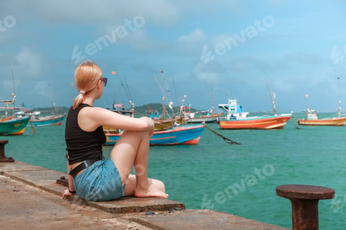 Preview: Travel. Travelers woman on the coast of the ocean on a tropical island. Solitude, wildlife, mental h