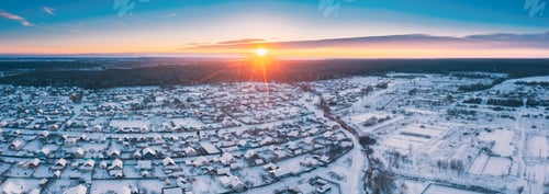 Preview: Sunny Winter Day. Aerial Panoramic View Of Small Town Village Cityscape Skyline Traffic In Snowy
