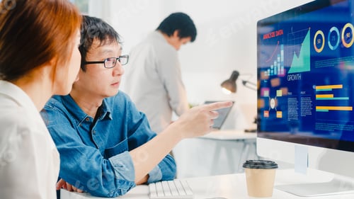 Preview: Group of young Asia businessman and businesswoman in small modern urban office.