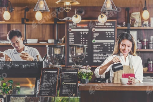 Preview: Asian Barista preparing cup of coffee, espresso with latte or cappuccino
