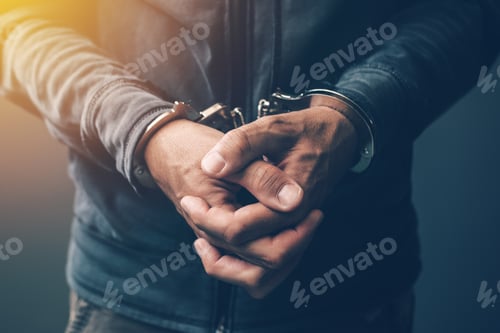 Preview: Arrested computer hacker with handcuffs