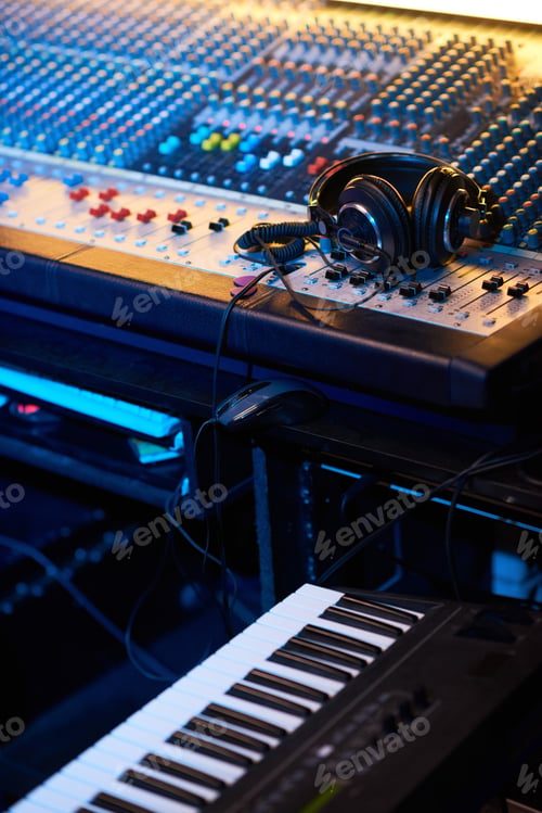 Preview: Headphones on music studio keyboard