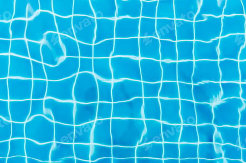 Preview: Water ripples on blue tiled swimming pool background. View from above.