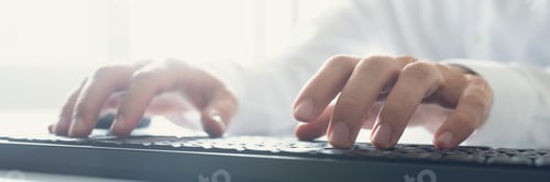 Preview: Wide view image of computer programmer typing