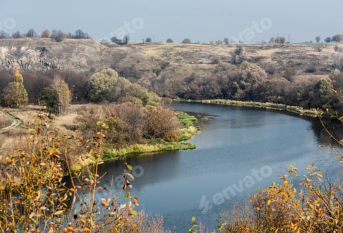 Preview: selective focus of lake with blue water near trees