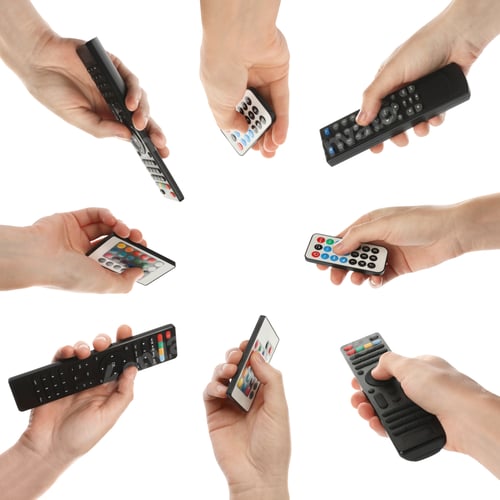 Preview: People holding different remote controllers on white background, closeup. Collage design