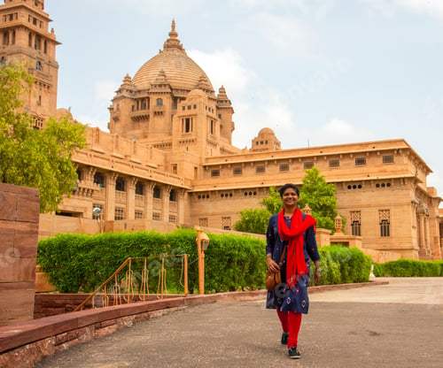 Preview: Woman tourist in front of Umaid Bhawan palace, Jodhpur, India