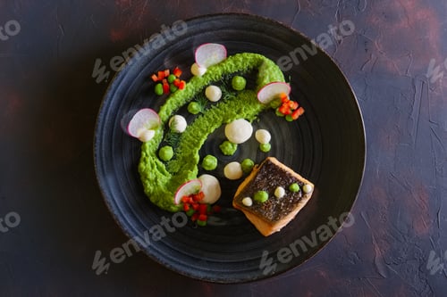 Preview: Fried salmon with pea mash decorated with radish and peas
