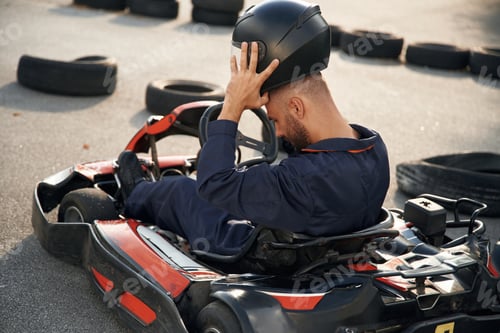 Preview: Adult Male Resting In Go-Kart after Race