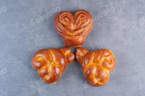 Preview: Arrangement of heart-shaped buns on marble background
