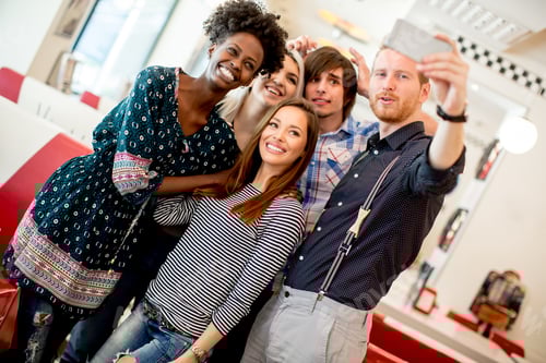 Preview: Group of young people taking selfie with mobile phone