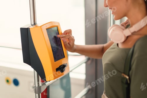 Preview: Passenger Woman Using Ticket Machine In Modern Tram Indoor, Cropped