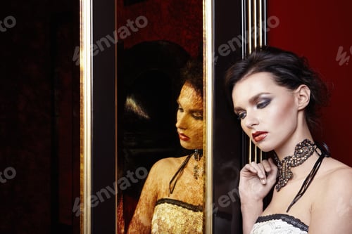 Elegant Woman with Lace Choker and Reflection