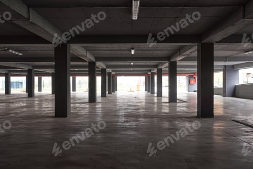 Preview: Empty underground parking lot or garage interior with concrete columns.