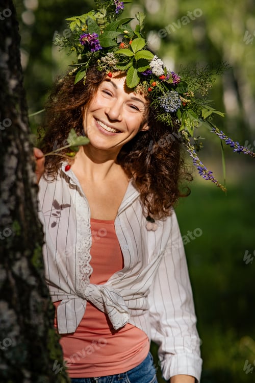 Preview: Cheerful woman laughing outdoors in wild meadow, unplugged and free