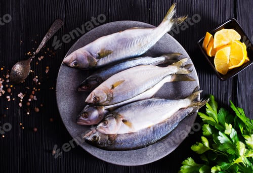 Preview: small fish on plate with spice and herb