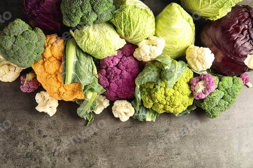 Preview: Different fresh cabbages on table, top view. Healthy food