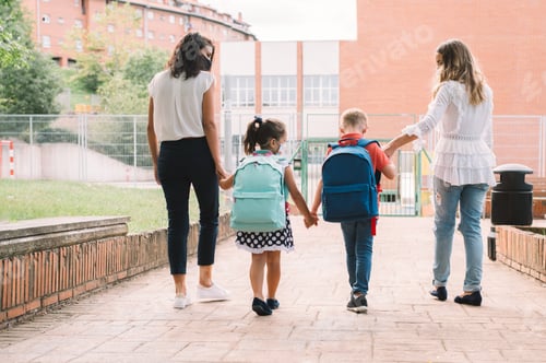 Preview: Two women and two children holding hands from back go to school for first time