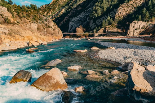 Preview: Landscape image of a river zigzagging between mountains