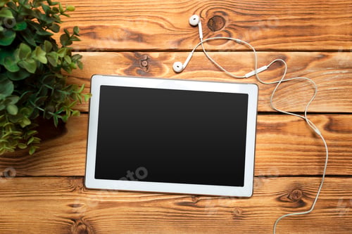 Preview: White digital tablet on wooden table
