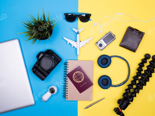 Preview: flat lay top view of traveler photographer accessories on yellow background