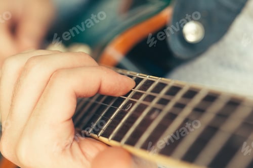 Preview: man playing electric guitar