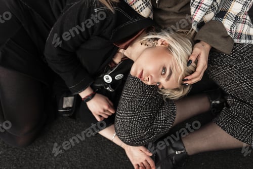 Preview: Stylish urban woman in black clothes in sunglasses. Attractive cute girlfriends in youth outfit