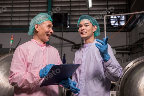 Preview: Worker Checking quality or checking stock of glass bottle in beverage factory.