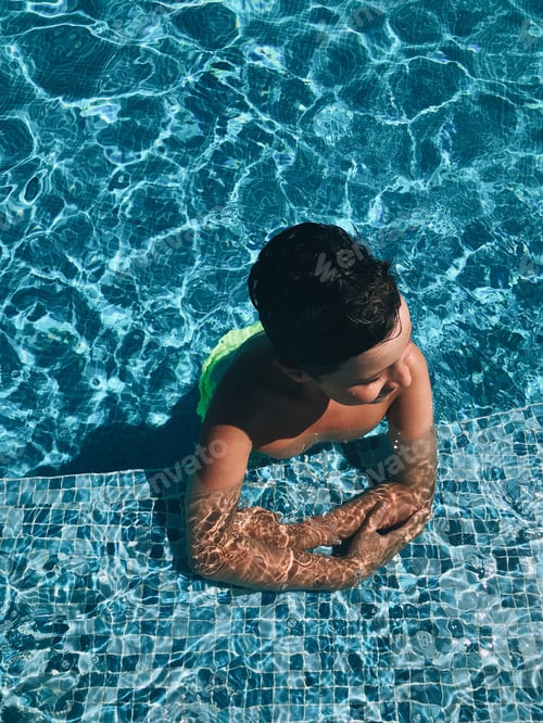 Preview: boy relaxing in the pool vacation summer