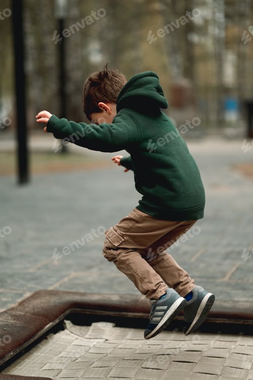 Preview: A little boy jumps on a trampoline