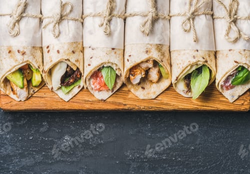Preview: Delicious Wraps on Wooden Board with Copy Space