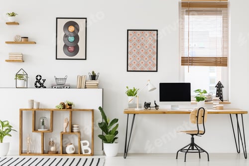 Preview: Real photo of a desk with a mockup computer screen, ornaments an