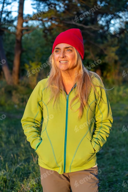 Preview: Portrait of an outdoor adventure woman enjoying scenic surroundings