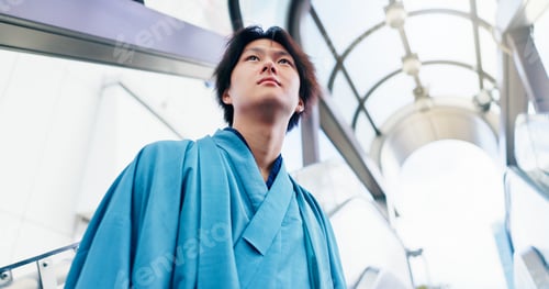 Preview: Man, thinking and escalator with traditional clothes, outfit and yukata for heritage. Japanese guy,
