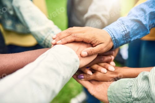 Preview: Cropped shot of a group of people joining their hands together