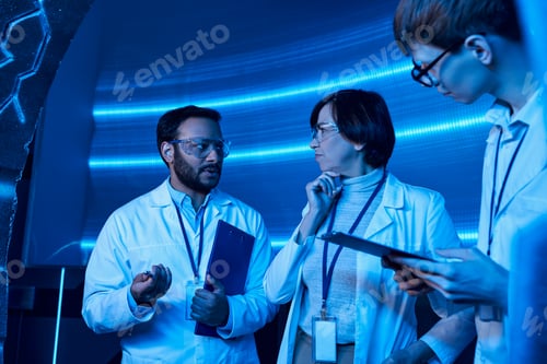 Preview: indian scientist talking to team while working on invention in innovation hub
