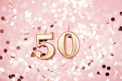 Preview: Number 50 fifty golden celebration birthday candle on Festive Background.